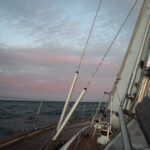 ocean sailing at sunset